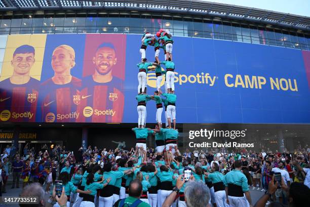 Group performs outside the stadium prior to the friendly match between FC Barcelona and Manchester City at Camp Nou on August 24, 2022 in Barcelona,...