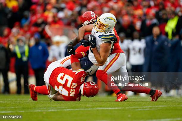 Damien Wilson of the Kansas City Chiefs tackles Hunter Henry of the Los Angeles Chargers during an NFL football game, Sunday, Dec. 29 in Kansas City,...