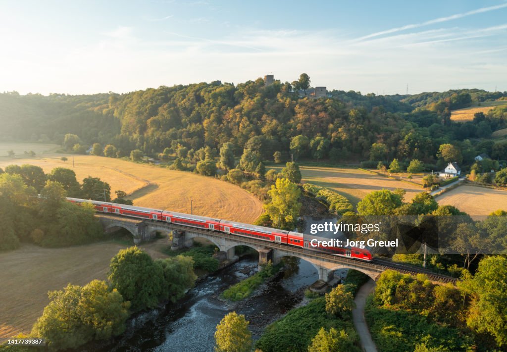 Commuter train crossing a bridge