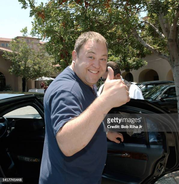 Actor Mark Addy gives a 'thumps up' while getting into his waiting limo enroute to airport to fly back to England for his brothers wedding after a...
