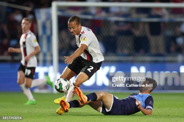 Kane Wilson of Bristol City is challenged by Joe Jacobson of Wycombe Wanderers during the Carabao Cup Second Round match between Wycombe Wanderers...