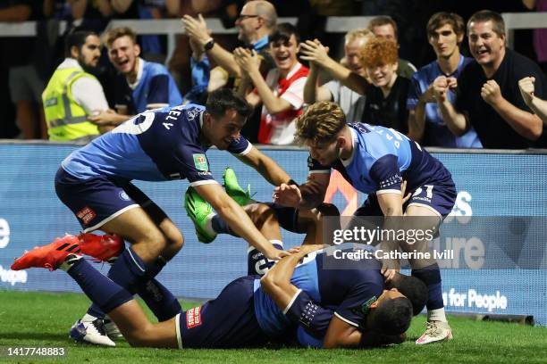 Ali Al Hamadi of Wycombe Wanderers celebrates their team's first goal with teammates during the Carabao Cup Second Round match between Wycombe...