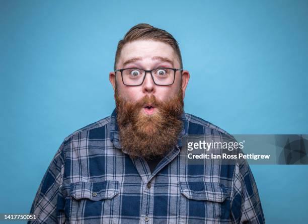 large man making funny, surprised face - surprise fotografías e imágenes de stock