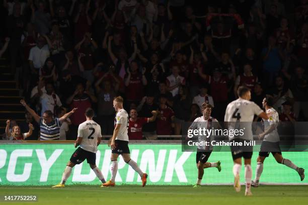 Kane Wilson of Bristol City celebrates their team's second goal with teammate Tommy Conway during the Carabao Cup Second Round match between Wycombe...