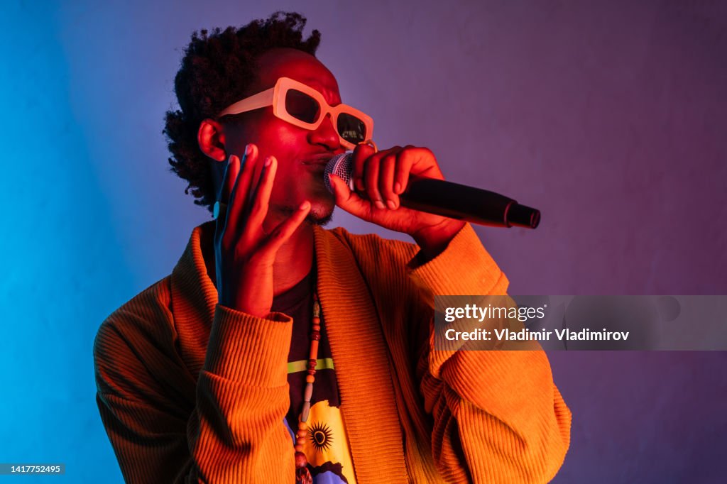 African man singing and gesturing with his hands