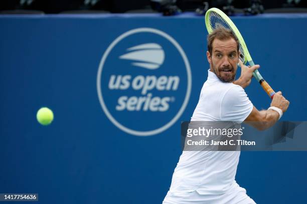 Richard Gasquet of France returns a shot to Steve Johnson of United States during their third round match on day five of the Winston-Salem Open at...