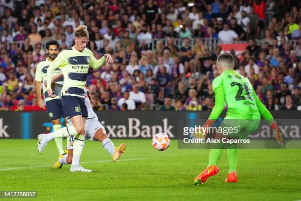 Cole Palmer of Manchester City scores their team's second goal during the friendly match between FC Barcelona and Manchester City at Camp Nou on...