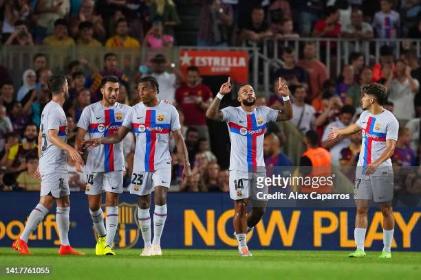 Memphis Depay of FC Barcelona celebrates after scoring their team's third goal during the friendly match between FC Barcelona and Manchester City at...