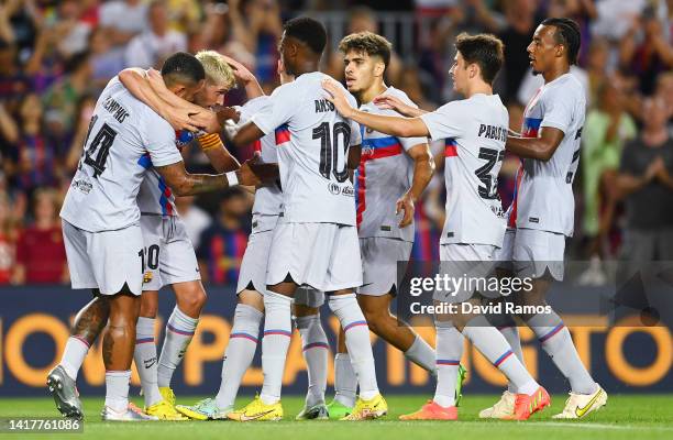 Memphis Depay of FC Barcelona celebrates with team mates after scoring their team's third goal during the friendly match between FC Barcelona and...