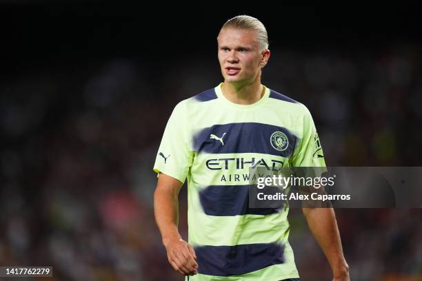 Erling Haaland of Manchester City looks on during the friendly match between FC Barcelona and Manchester City at Camp Nou on August 24, 2022 in...