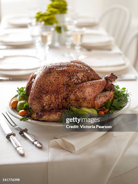roasted thanksgiving turkey presented on table. - roast turkey stockfoto's en -beelden