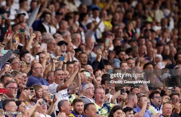 Leeds United fans applaud during the Carabao Cup Second Round match between Leeds United and Barnsley at Elland Road on August 24, 2022 in Leeds,...