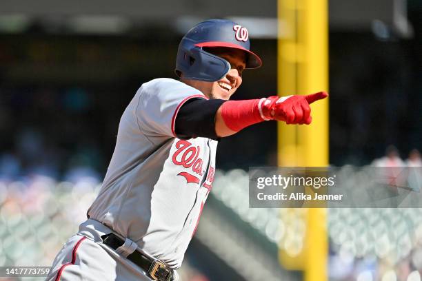 Ildemaro Vargas of the Washington Nationals gestures after hitting a two run home run during the ninth inning against the Seattle Mariners at...