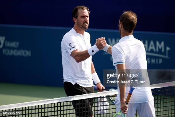 Richard Gasquet of France shakes hands with Steve Johnson of United States following their third round match on day five of the Winston-Salem Open at...