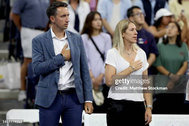 Former ATP player Sergiy Stakhovsky and former WTA player Olga Savchuk of Ukraine stand for the Ukraine national anthem during Tennis Plays For...