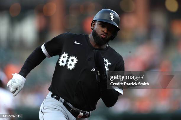 Luis Robert of the Chicago White Sox rounds the bases before scoring a run against the Baltimore Orioles during the first inning at Oriole Park at...