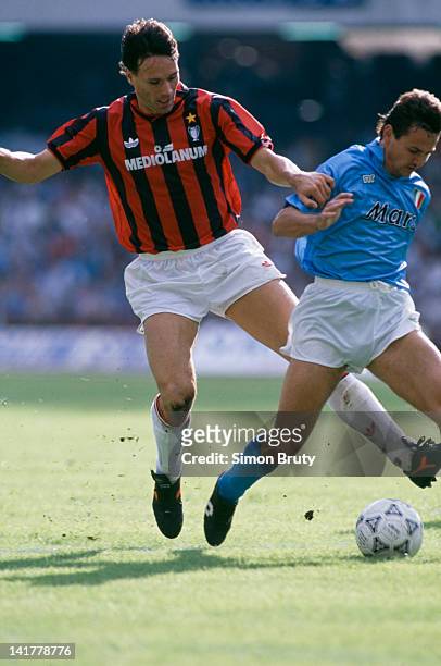 Dutch footballer Marco van Basten , of AC Milan, in action against Napoli in a Serie A match at the Stadio San Paolo, Naples, 21st October 1990. The...