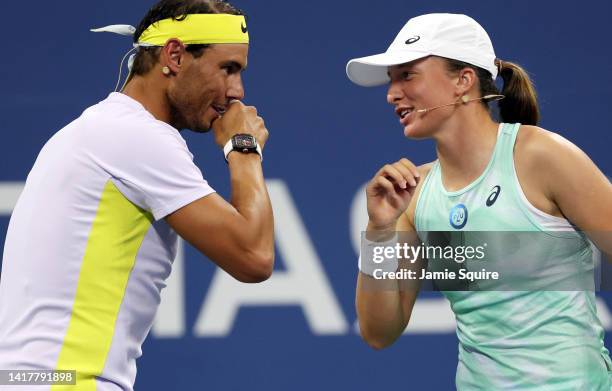 Iga Swiatek of Poland and Rafael Nadal of Spain plot strategy during Tennis Plays For Peace, exhibition matches to benefit Ukraine, against John...