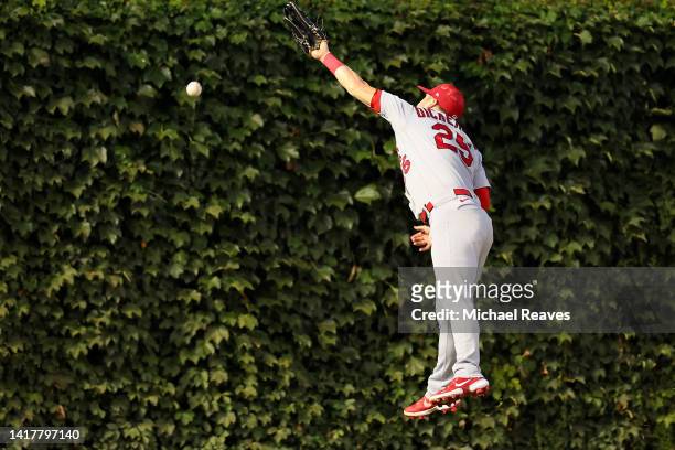 Corey Dickerson of the St. Louis Cardinals can't catch a double hit by Nelson Velazquez of the Chicago Cubs during the second inning at Wrigley Field...