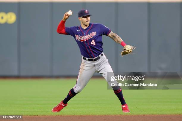 Carlos Correa of the Minnesota Twins throws out Yuli Gurriel of the Houston Astros during the sixth inning at Minute Maid Park on August 24, 2022 in...
