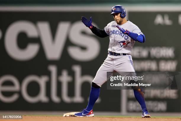 George Springer of the Toronto Blue Jays celebrates after a RBI double during the tenth inning at Fenway Park on August 24, 2022 in Boston,...
