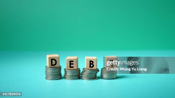 debt concept photo on word block with copyspace - government debt stock pictures, royalty-free photos & images