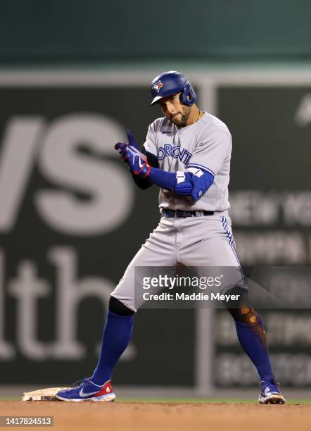 George Springer of the Toronto Blue Jays celebrates after a RBI double during the tenth inning at Fenway Park on August 24, 2022 in Boston,...