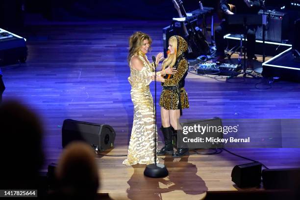 Shania Twain and Avril Lavigne speak onstage during the 15th Annual Academy Of Country Music Honors at Ryman Auditorium on August 24, 2022 in...