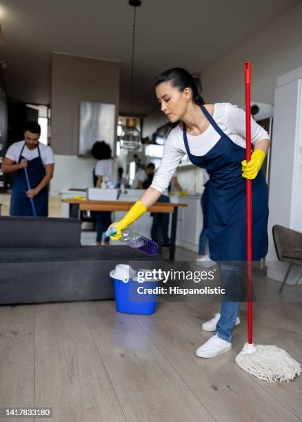 professional cleaner mopping a hardwood floor - cleaning equipment stock pictures, royalty-free photos & images