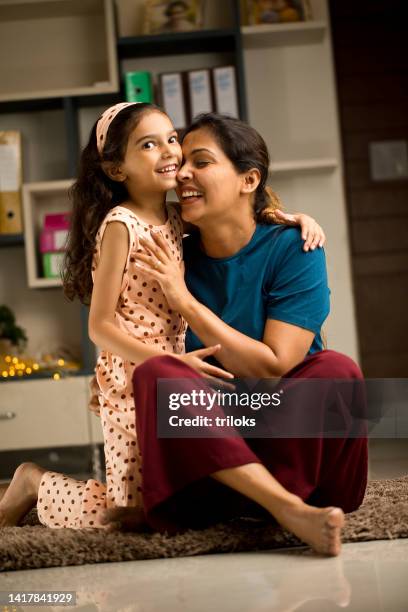 girl having fun with her mother at home - bare feet kneeling girl stock pictures, royalty-free photos & images