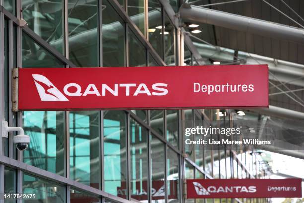Signage is seen on display at the Qantas domestic terminal at Sydney Airport on August 25, 2022 in Sydney, Australia. Qantas Group posted a loss of...
