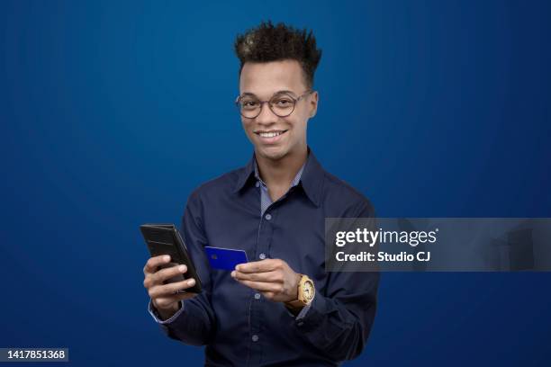 adult man making mobile app purchase payment - man made object bildbanksfoton och bilder