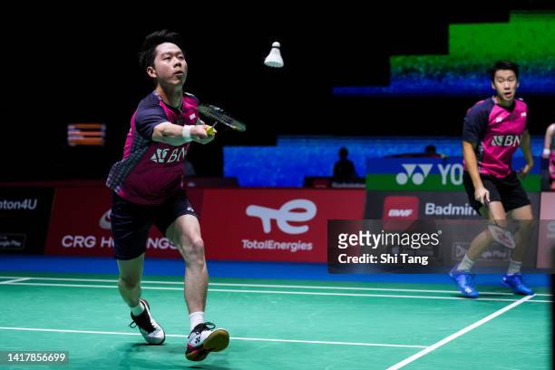 Marcus Fernaldi Gideon and Kevin Sanjaya Sukamuljo of Indonesia compete in the Men's Doubles Third Round match against Ben Lane and Sean Vendy of...