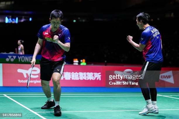 Mohammad Ahsan and Hendra Setiawan of Indonesia react in the Men's Doubles Third Round match against Mark Lamsfuss and Marvin Seidel of Germany on...