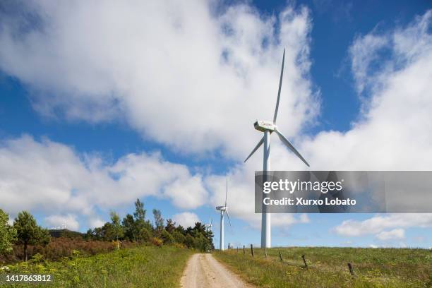 Windmills of the wind farm in San Mamede de Cerredo, owned by the energy company Acciona, are seen on June 4, 2021 on A Fonsagrada, Galicia, Spain....