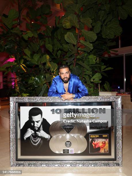 Artist French Montana receives a certified diamond plaque for his song "Unforgettable" at the French Montana Unforgettable Diamond Dinner on August...