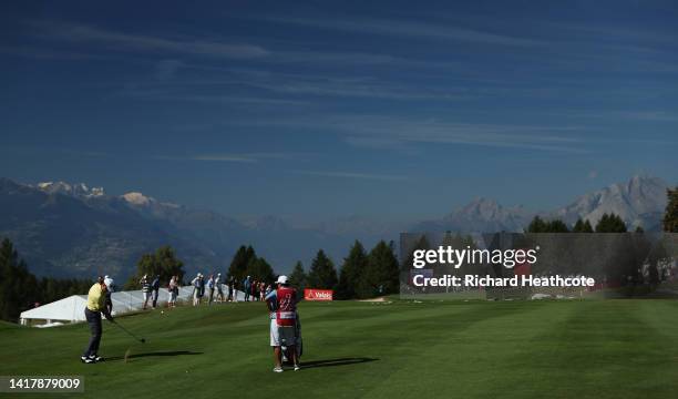 Miguel Angel Jimenez of Spain plays his second shot on the 17th hole during Day One of the Omega European Masters at Crans-sur-Sierre Golf Club on...