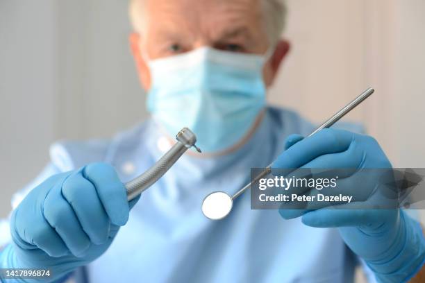 dentist and drill - dentist phobia stock-fotos und bilder