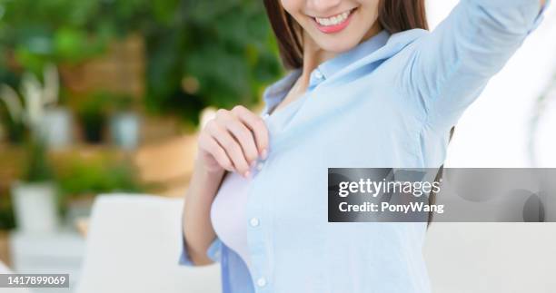 girl looking her armpit - female armpits stock pictures, royalty-free photos & images