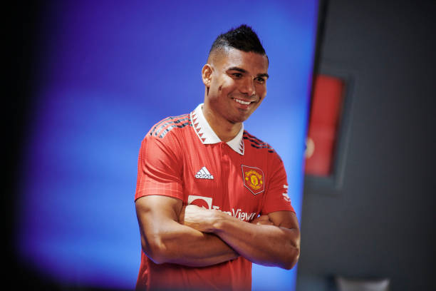 Casemiro of Manchester United poses after signing for the club at Carrington Training Ground on August 25, 2022 in Manchester, England.