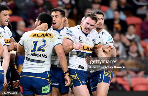 Clinton Gutherson of the Eels celebrates scoring a try during the round 24 NRL match between the Brisbane Broncos and the Parramatta Eels at Suncorp...