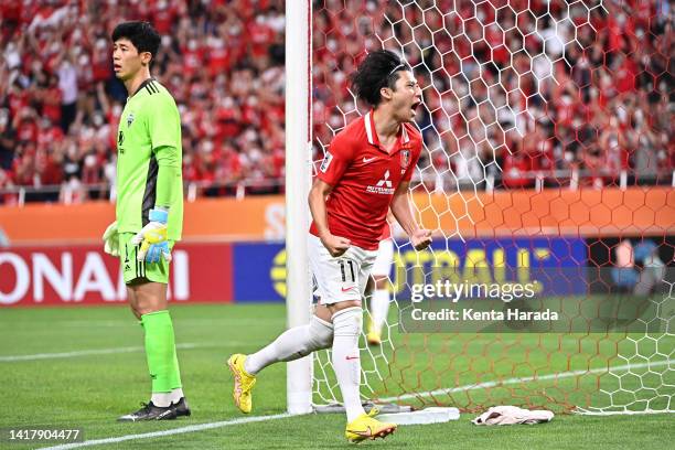 Yusuke Matsuo of Urawa Red Diamonds celebrates scoring his side's first goal during the AFC Champions League semi final between Jeonbuk Hyundai...