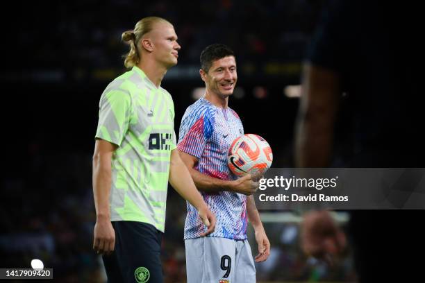 Erling Haaland of Manchester City and Robert Lewandowski of FC Barcelona speak prior to the friendly match between FC Barcelona and Manchester City...