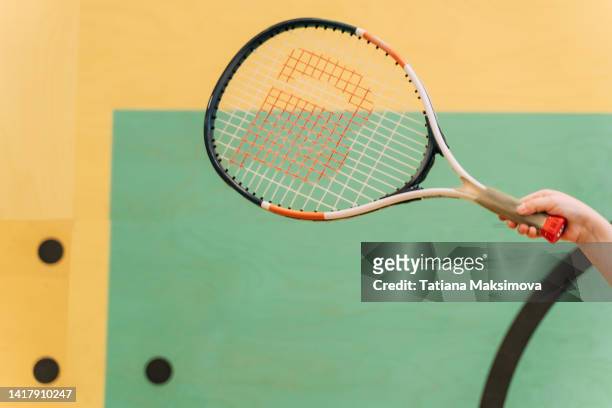 squash racket on a multicolored background. - squash racquet stock-fotos und bilder