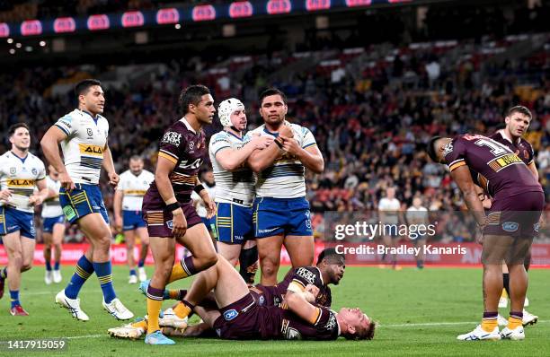 Isaiah Papali'i of the Eels celebrates scoring a try during the round 24 NRL match between the Brisbane Broncos and the Parramatta Eels at Suncorp...