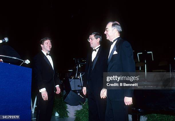 Head coach Al Arbour and general manager Bill Torrey walk to the microphone during the 1983 NHL All Star dinner on February 7, 1983 in Uniondale, New...