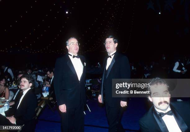 Head coach Al Arbour and general manager Bill Torrey walk to the microphone during the 1983 NHL All Star dinner on February 7, 1983 in Uniondale, New...