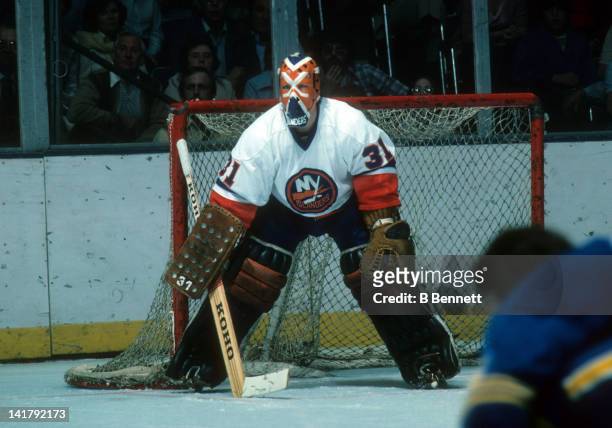 Goalie Billy Smith of the New York Islanders defends the net during an NHL game circa 1976 at the Nassau Coliseum in Uniondale, New York.