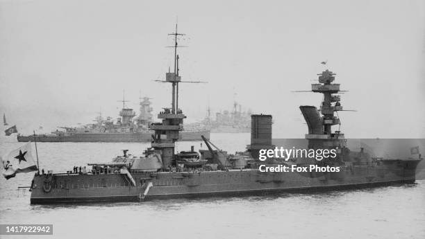 The Soviet Navy Sevastopol-class Dreadnought Battleship the Marat lays at anchor alongside the Nazi German Kriegsmarine Deutschland-class...