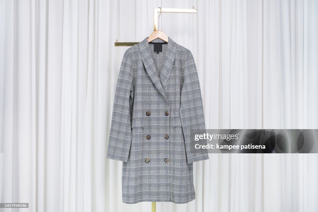 Plaid grey overcoat Hanging in home